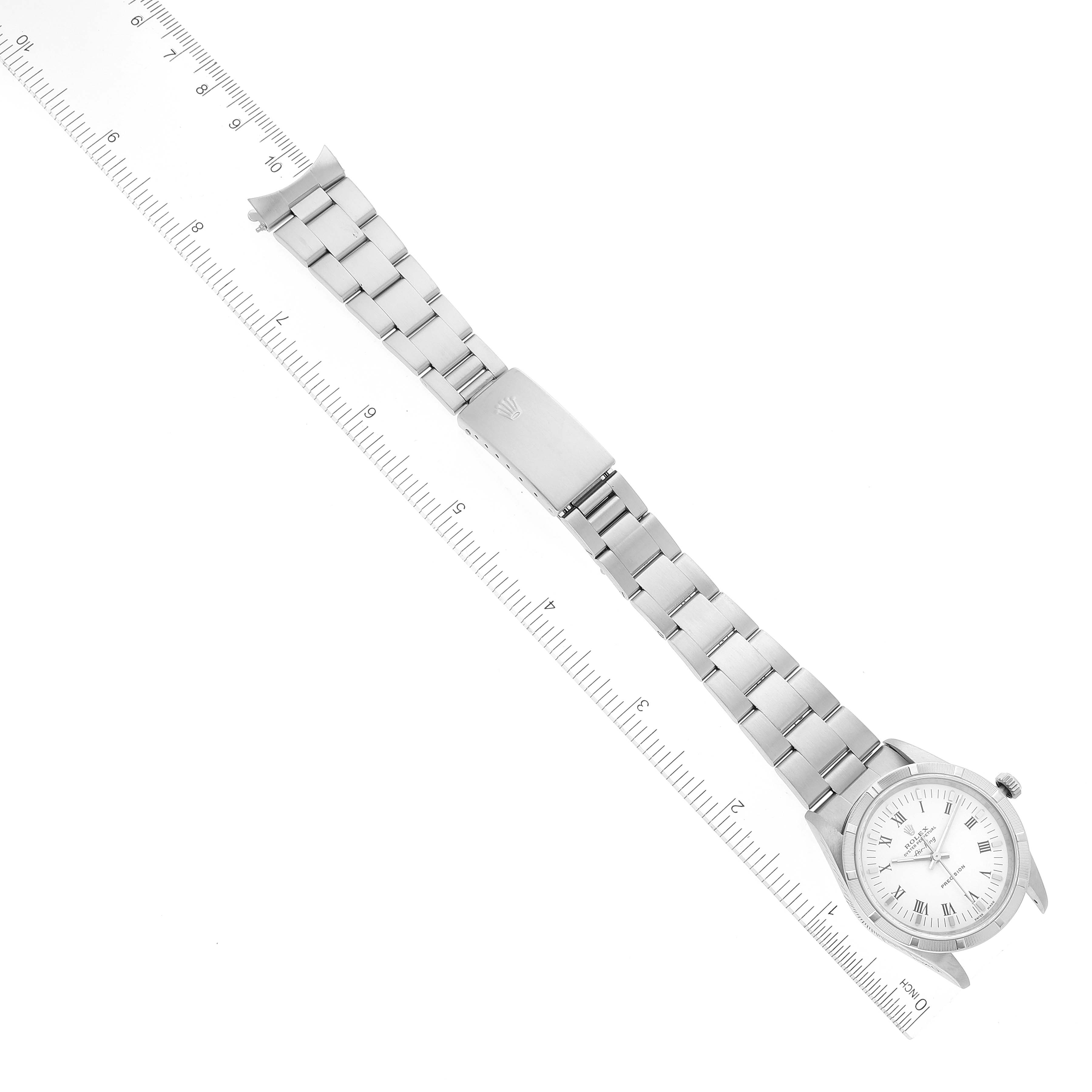 The image shows a Rolex Air-King 14010 Men's Stainless Steel White Dial 14010 Men's Stainless Steel White Dial watch laid flat, displaying the face, bracelet, and clasp next to a ruler for scale.