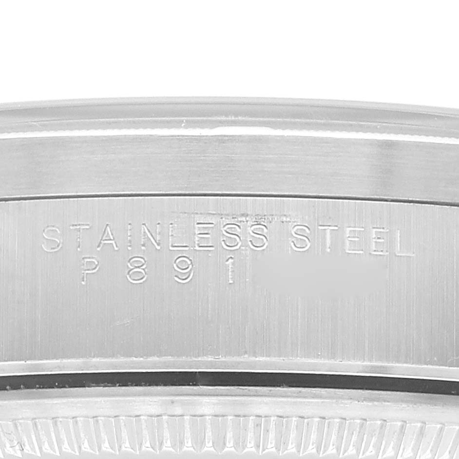 The image shows a close-up of the stainless steel case back and markings on a Rolex Air-King 14010 Men's Stainless Steel White Dial 14010 Men's Stainless Steel White Dial watch.