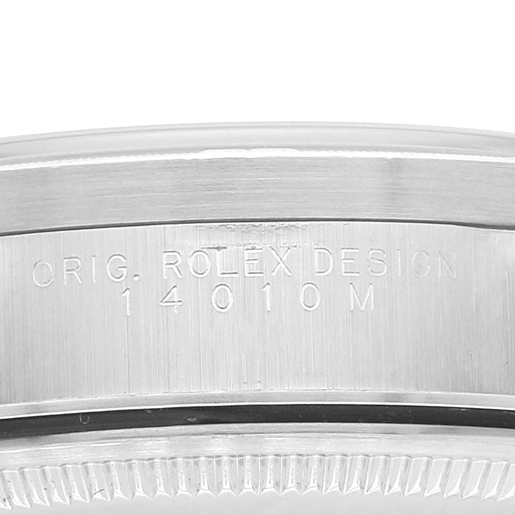 This image shows a close-up of the side bezel of a Rolex Air-King 14010 Men's Stainless Steel White Dial 14010 Men's Stainless Steel White Dial watch, showcasing the engraved design and model number.