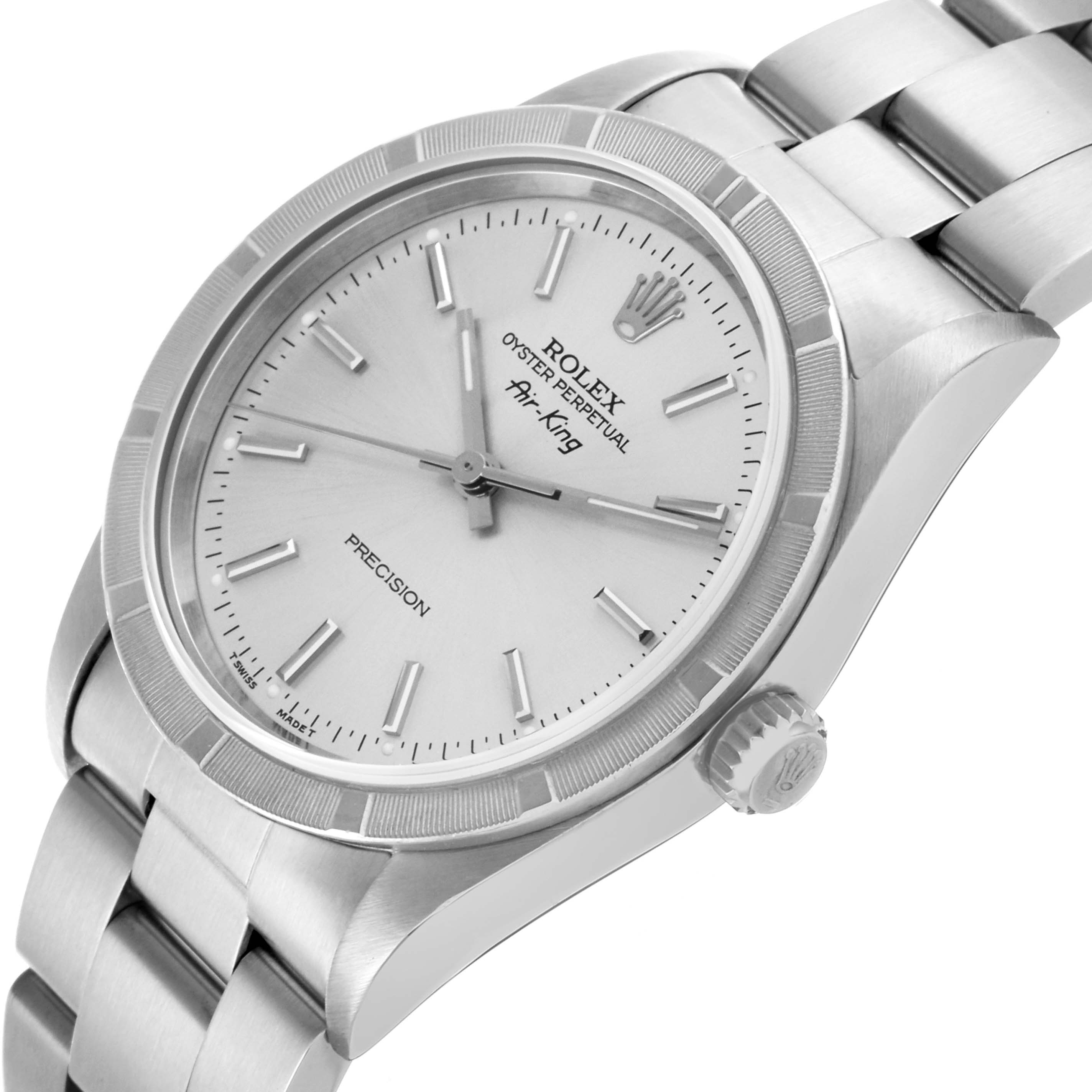 The Rolex Air-King 14010 Men's Stainless Steel Silver Dial 14010 Men's Stainless Steel Silver Dial watch is shown from an angled side view, highlighting the face, bezel, crown, and part of the bracelet.