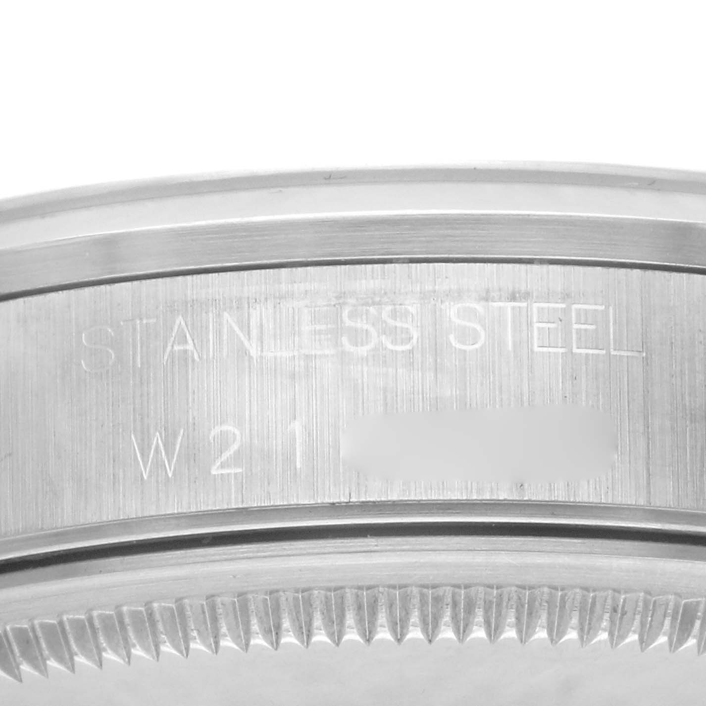 This image shows a close-up of the edge and markings on the stainless steel case back of a Rolex Air-King 14000 Men's Stainless Steel Silver Dial 14000 Men's Stainless Steel Silver Dial watch.