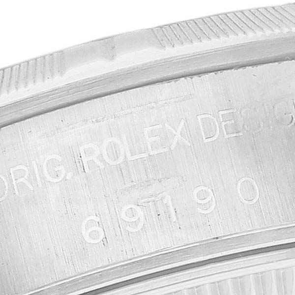 The image shows a close-up of the side case and bezel of a Rolex Date 69190 Women's Stainless Steel Silver Dial 69190 Women's Stainless Steel Silver Dial model watch.