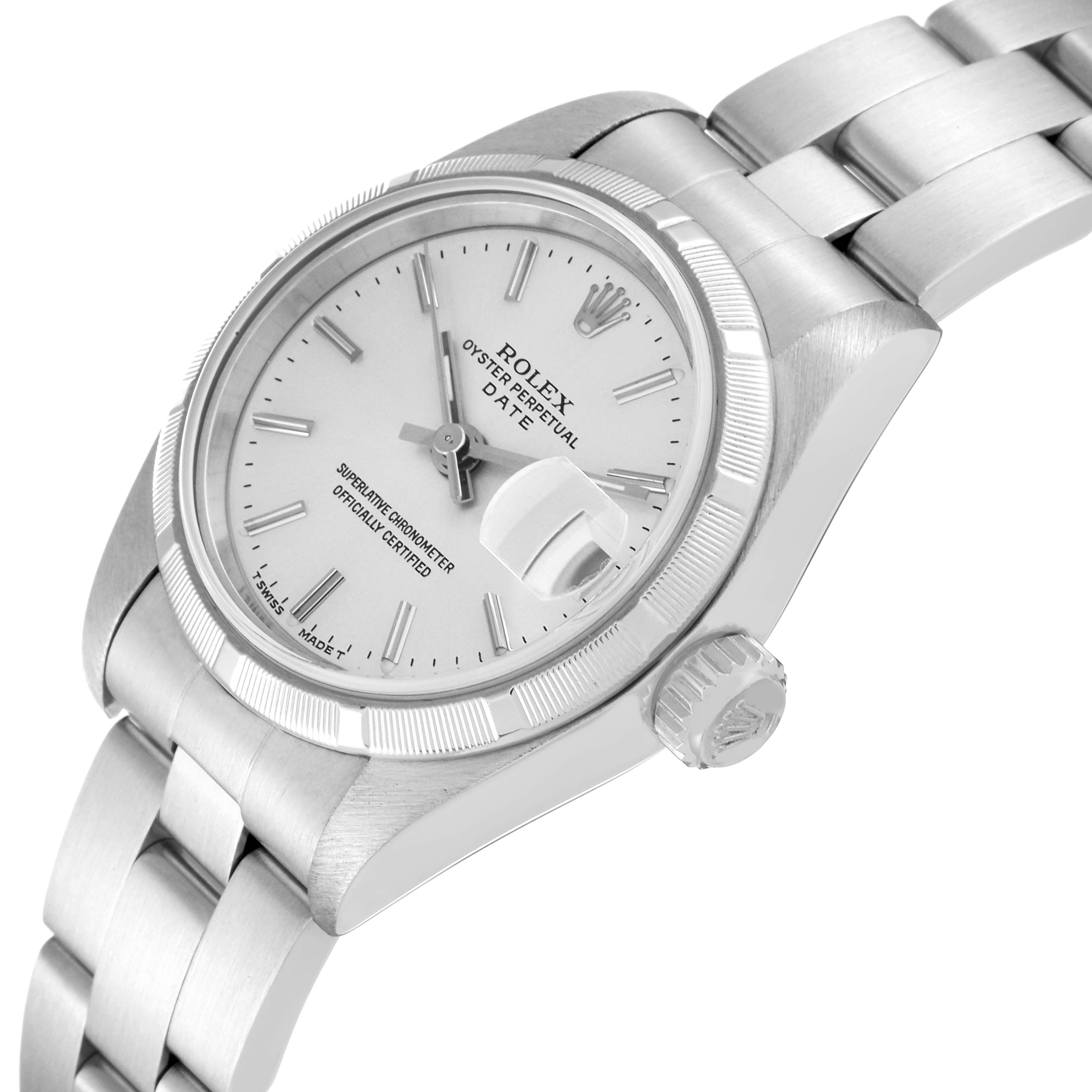 The image shows a close-up, angled view of a Rolex Date 69190 Women's Stainless Steel Silver Dial 69190 Women's Stainless Steel Silver Dial, highlighting the dial, bezel, crown, and part of the bracelet.