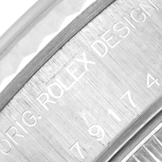 The image shows a close-up of the engraved inner bezel or rehaut on a Rolex Datejust 79174 Women's Stainless Steel White Dial 79174 Women's Stainless Steel White Dial watch.