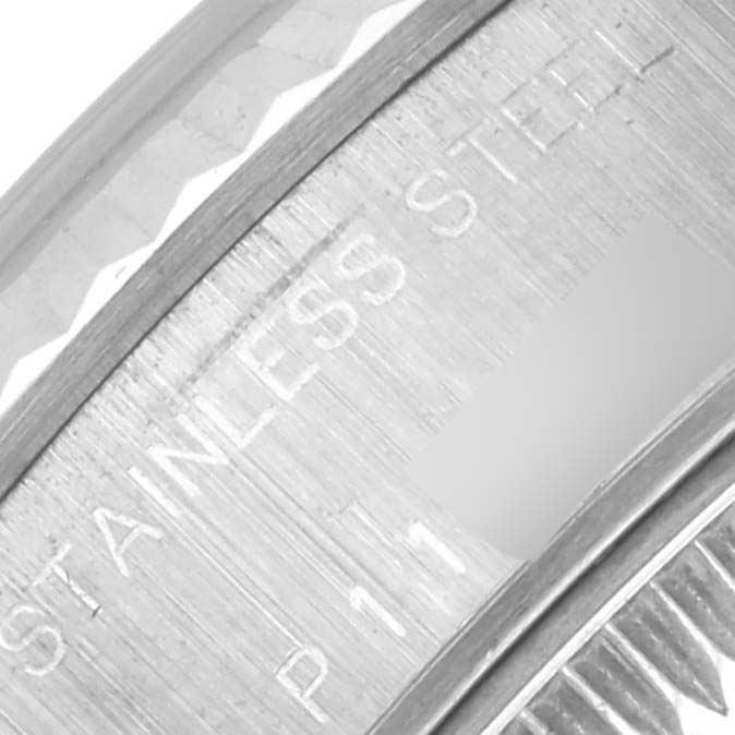 The image shows a close-up of the stainless steel bezel area of the Rolex Datejust 79174 Women's Stainless Steel White Dial 79174 Women's Stainless Steel White Dial.