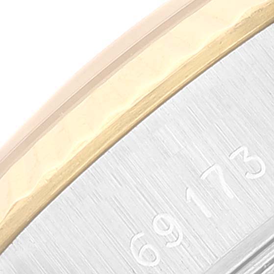 This close-up image shows a portion of the bezel and engraved numbers on a Rolex Datejust 69173 Women's Steel and Gold (two tone) Champagne Dial 69173 Women's Steel and Gold (two tone) Champagne Dial watch.