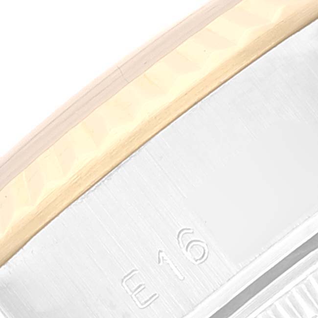 This close-up image shows part of the bezel and the inner rim with a serial number of a Rolex Datejust 69173 Women's Steel and Gold (two tone) Champagne Dial 69173 Women's Steel and Gold (two tone) Champagne Dial watch.