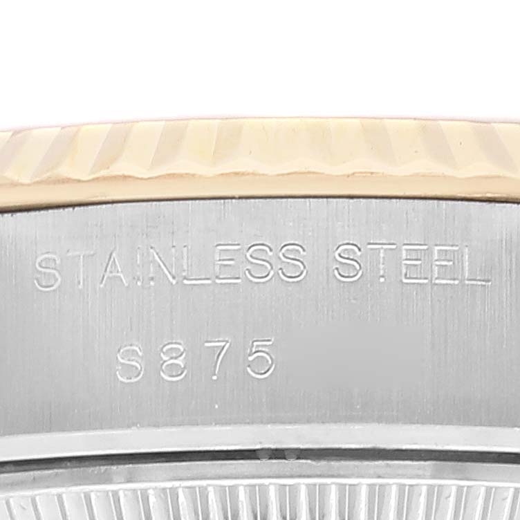 This close-up image shows the inscription on the stainless steel case of a Rolex Datejust 69173 Women's Steel and Gold (two tone) Champagne Dial 69173 Women's Steel and Gold (two tone) Champagne Dial watch.