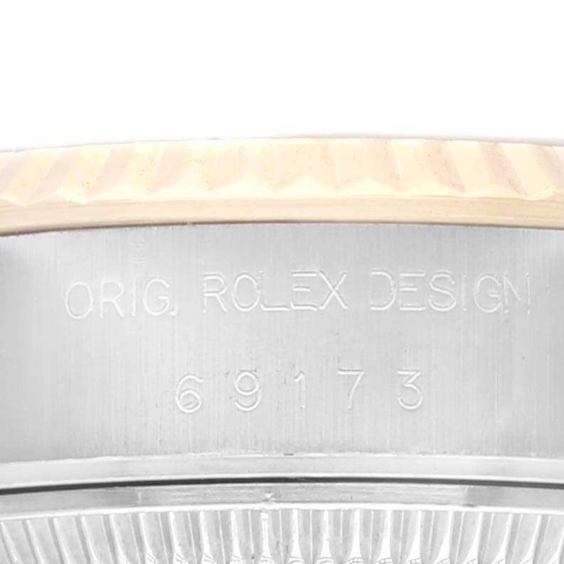 The image shows a close-up of the case side of a Rolex Datejust 69173 Women's Steel and Gold (two tone) Champagne Dial 69173 Women's Steel and Gold (two tone) Champagne Dial, highlighting the model number and "Orig. Rolex Design" engraving.