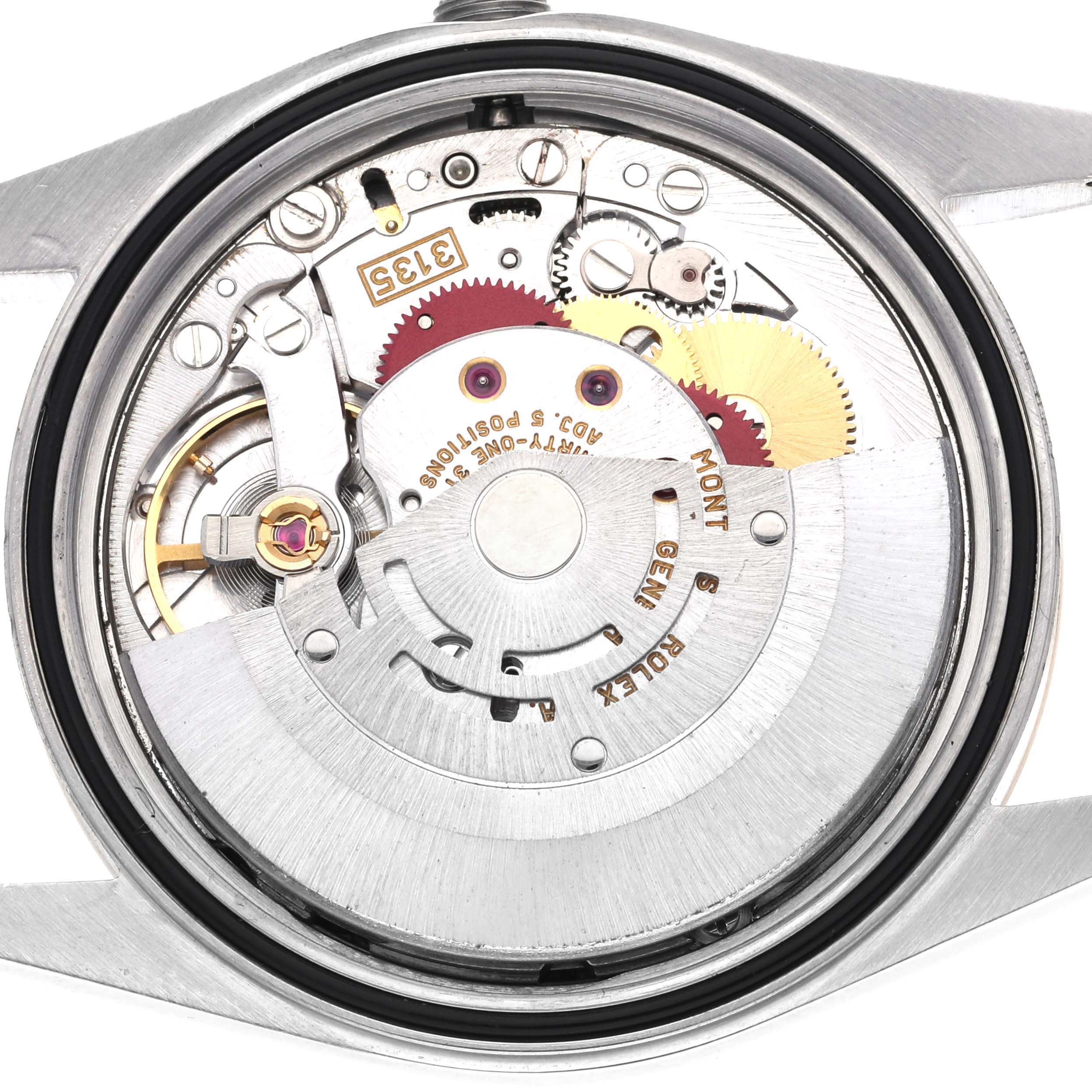 The image shows the back view of a Rolex Datejust 16233 Men's Steel and Gold (two tone) Black Dial 16233 Men's Steel and Gold (two tone) Black Dial watch, highlighting its intricate movement mechanism.