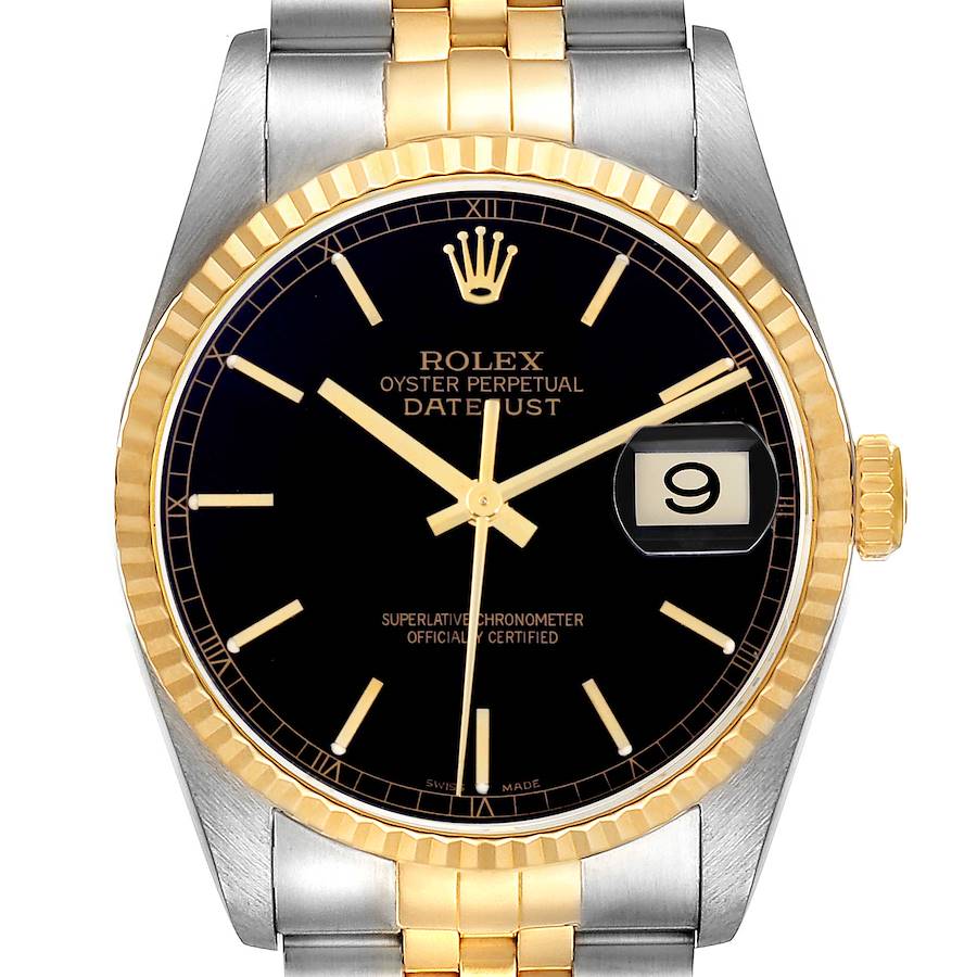 The Rolex Datejust is shown from the front, displaying its black dial, gold bezel, markers, and bracelet.