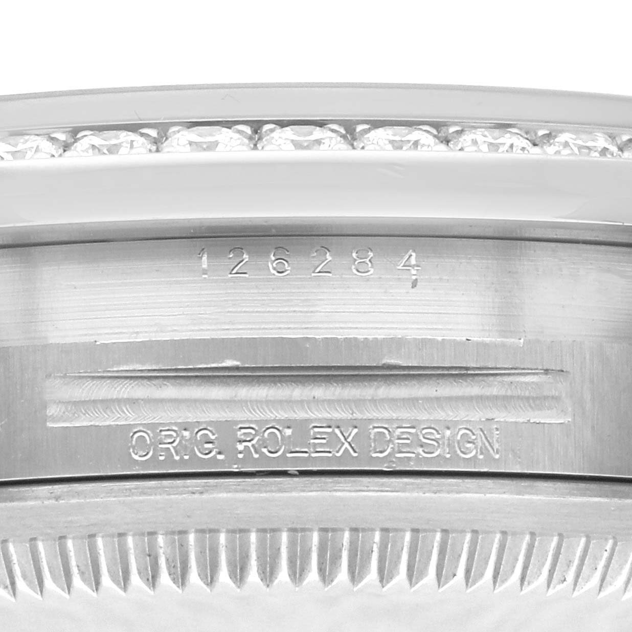 The image shows a close-up of the bezel and case side, featuring the serial engraving of a Rolex Datejust 126284RBR Men's Stainless Steel Grey Dial 126284RBR Men's Stainless Steel Grey Dial.