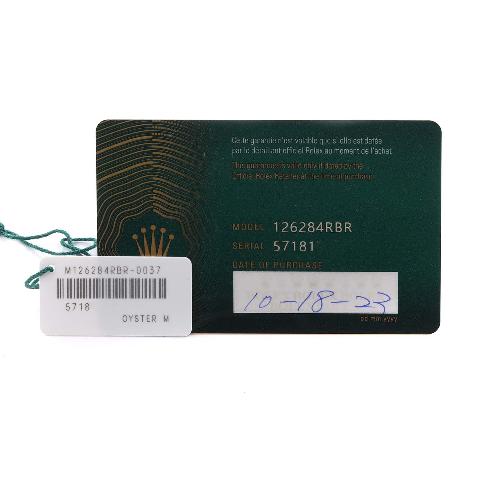 The image shows a warranty card and tag for a Rolex Datejust 126284RBR Men's Stainless Steel Grey Dial 126284RBR Men's Stainless Steel Grey Dial model 126284RBR.