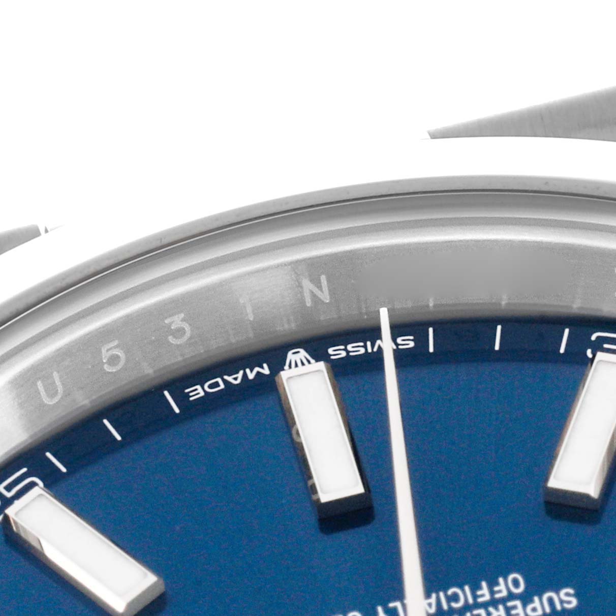 The image shows a close-up of the dial and rehaut of the Rolex Datejust 41 126300 Men
s Stainless Steel Blue Dial 126300 Men
s Stainless Steel Blue Dial, focusing on the hour markers and part of the chapter ring.