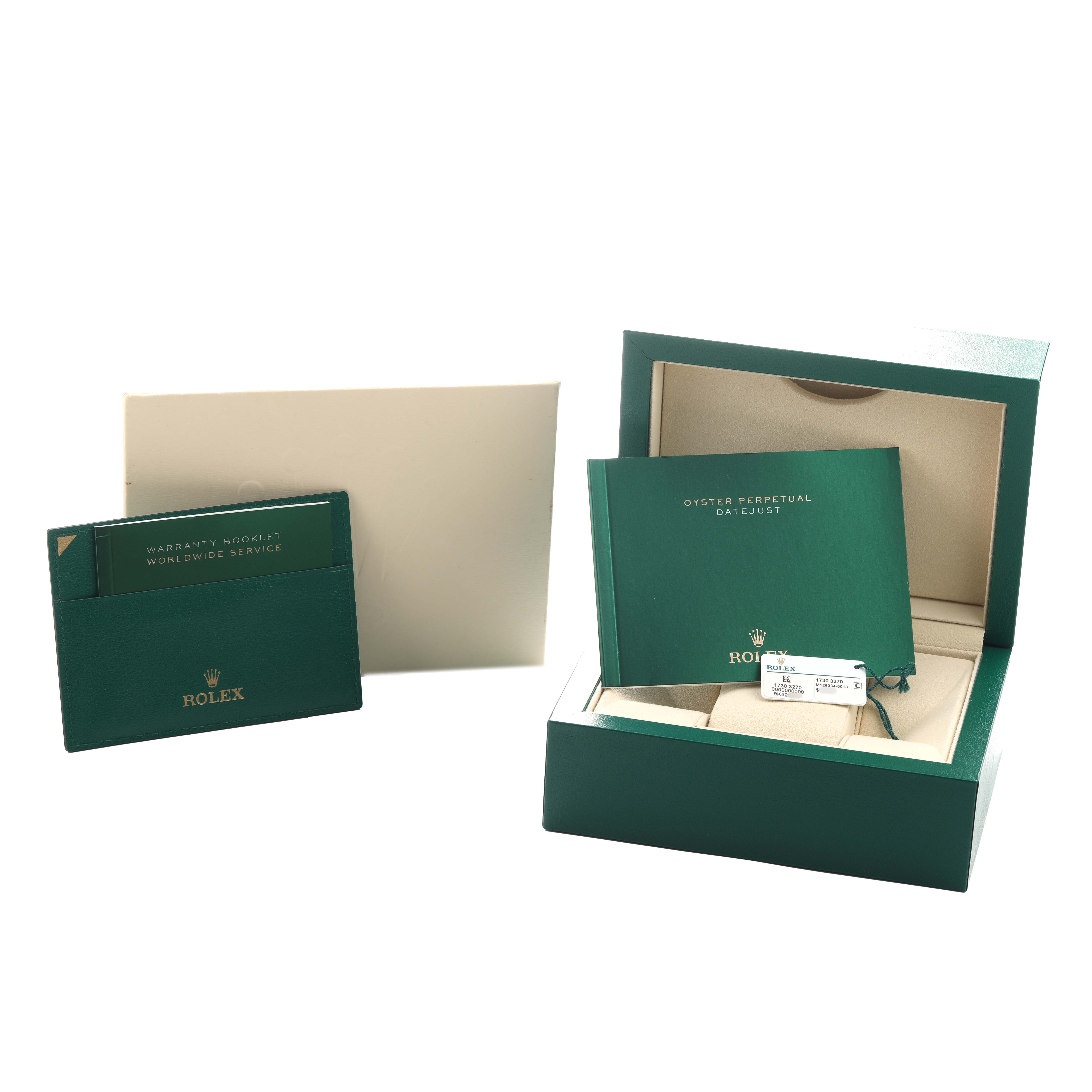 The image shows a Rolex Datejust 41 126334 Men's Stainless Steel Grey Dial packaging, warranty booklet, and manual at an angle displaying the open box and documents.