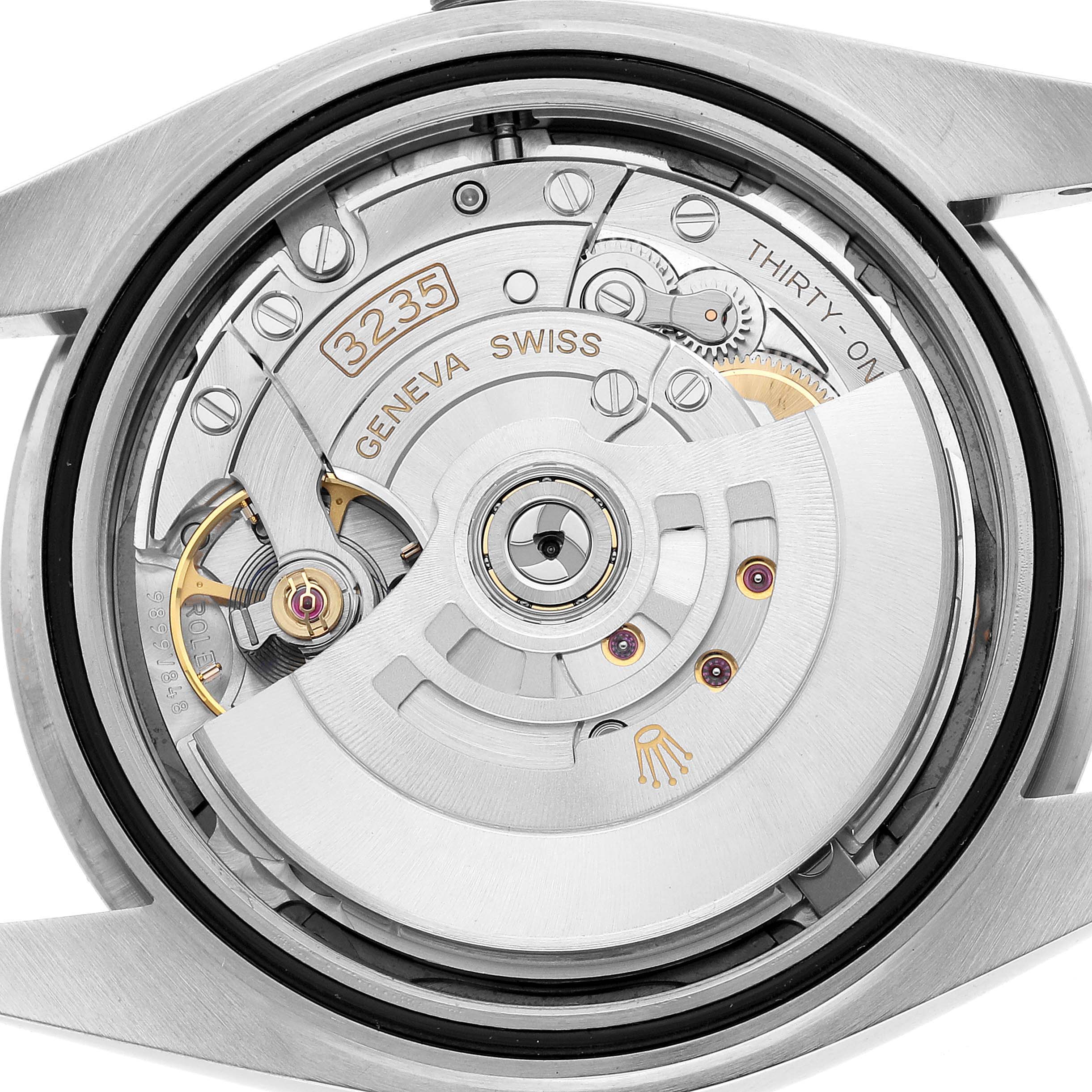 The image shows the back view of a Rolex Datejust 41 126334 Men's Stainless Steel Grey Dial, highlighting its intricate movement and rotor.