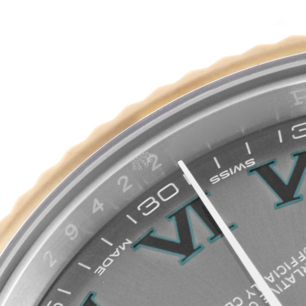 The image shows a close-up of the Rolex Datejust 41 116333 Men's Steel and Gold (two tone) Grey Dial 116333 Men's Steel and Gold (two tone) Grey Dial watch's dial and a portion of the bezel from an angled view.