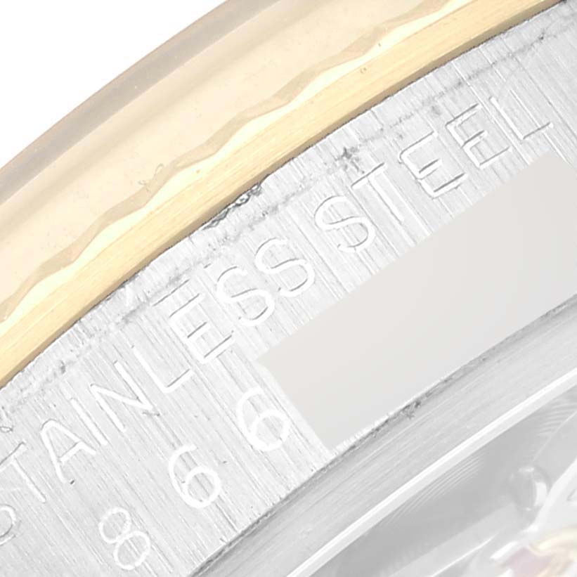 This close-up angle shows the side of the bezel and part of the case back with "STAINLESS STEEL" engraved on the Rolex Datejust 16013 Men's Steel and Gold (two tone) Champagne Dial 16013 Men's Steel and Gold (two tone) Champagne Dial watch.