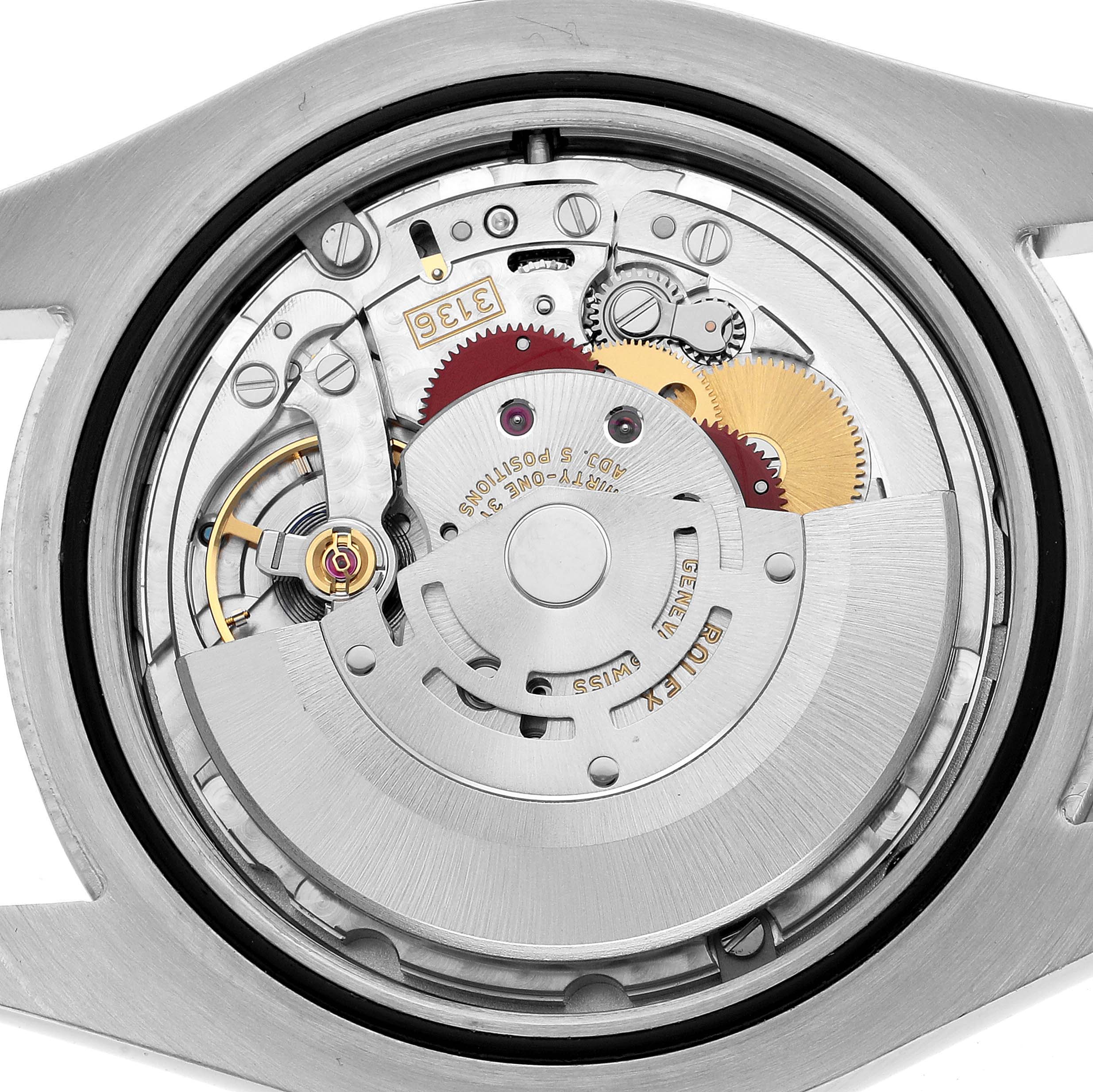 This image shows the internal movement mechanism of a Rolex Datejust 41 116300 Men's Stainless Steel White Dial, viewed from the back.