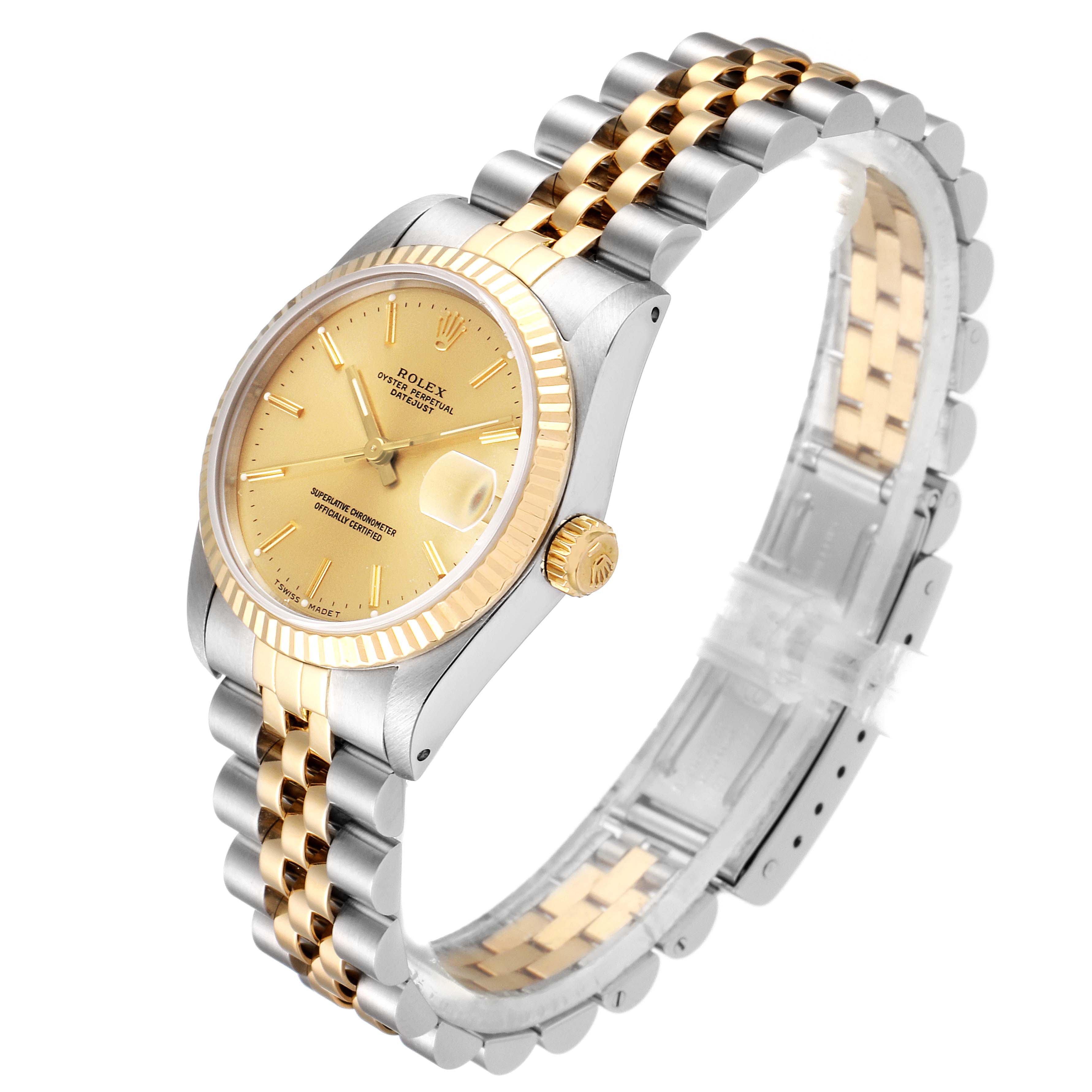 The Mid-Size Rolex watch is shown at a three-quarter angle, revealing its gold face, fluted bezel, and two-tone bracelet.