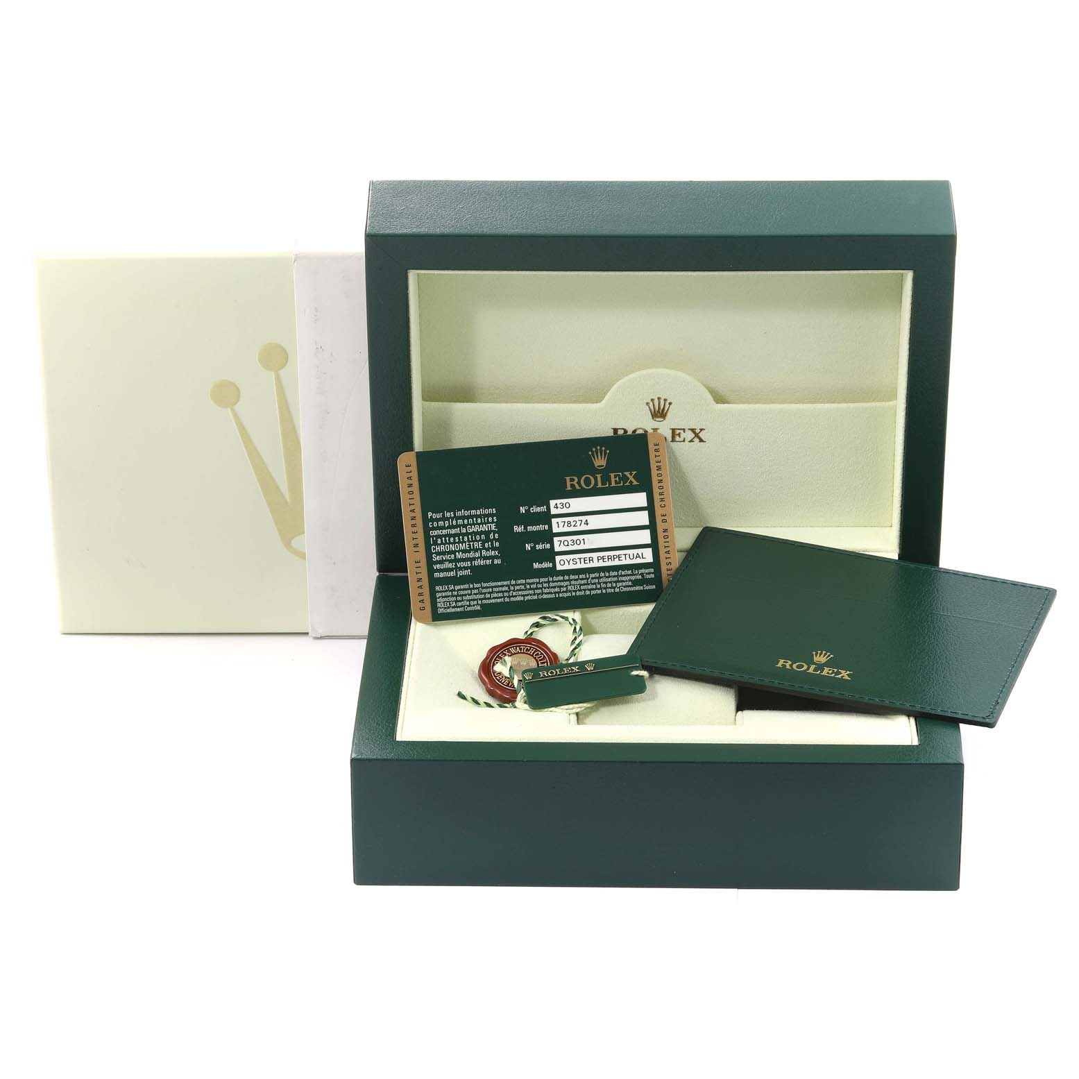 The image shows the packaging, warranty card, wallet, and tag for a Mid-Size Rolex model, with no watch visible.
