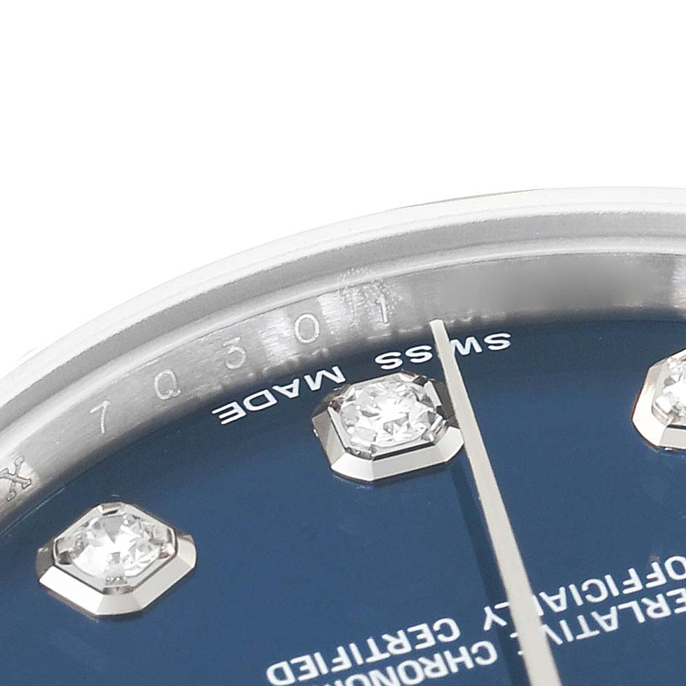 This image shows a close-up of the dial and bezel of a Mid-Size Rolex watch, highlighting the diamonds and "Swiss Made" text.