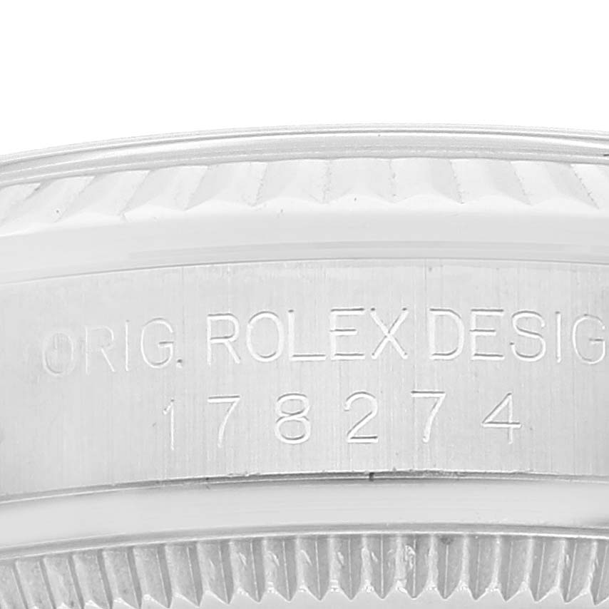 This image shows an engraved side view of the caseback and bezel of a Mid-Size Rolex watch.