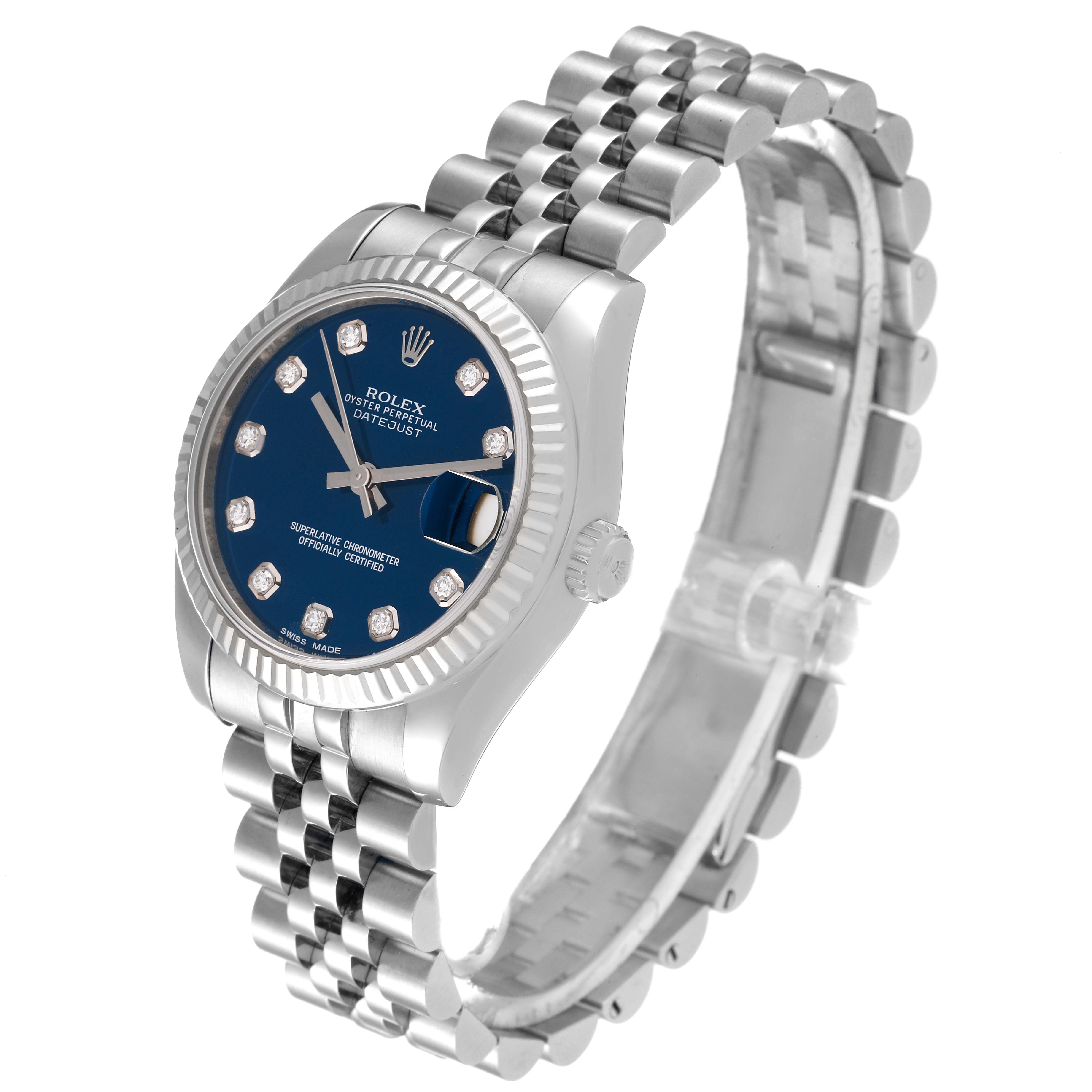 The image shows a side angle view of a Rolex Mid-Size 178274 Women
s Stainless Steel Blue Dial 178274 Women
s Stainless Steel Blue Dial Datejust watch, highlighting its blue dial, bezel, and bracelet.