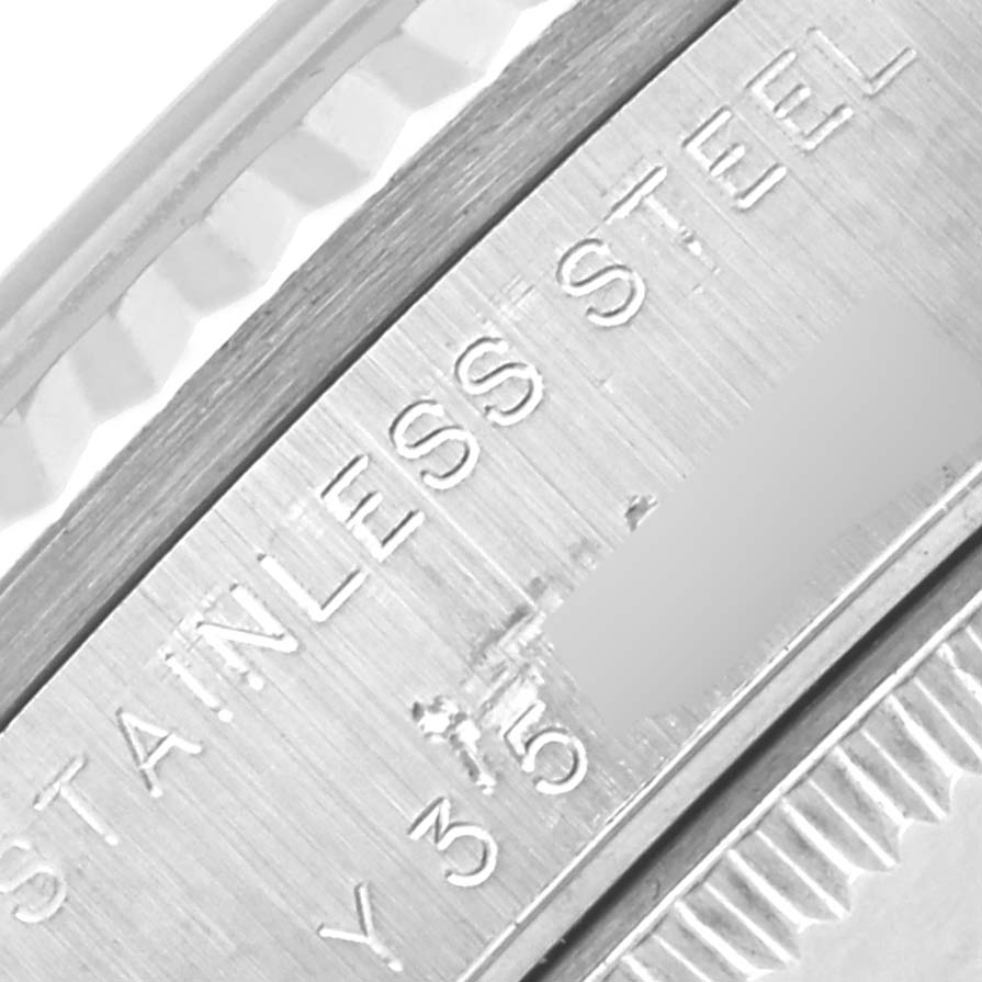 The image shows a close-up of the engraved case back and bezel edge of the Rolex Mid-Size 78274NRD Women's Stainless Steel Mother of Pearl Dial 78274NRD Women's Stainless Steel Mother of Pearl Dial watch in stainless steel.