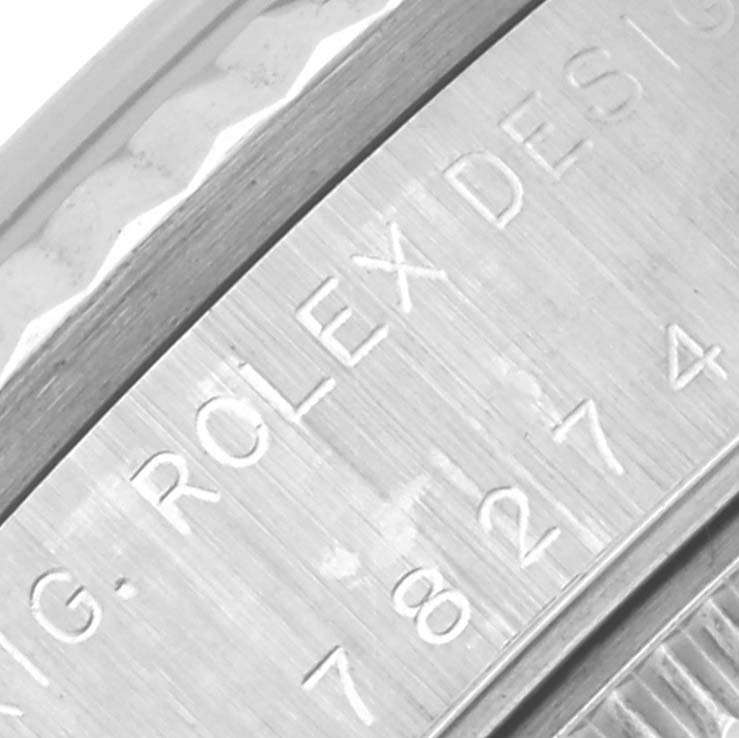 The image shows a close-up of the side of a Rolex Mid-Size 78274NRD Women's Stainless Steel Mother of Pearl Dial 78274NRD Women's Stainless Steel Mother of Pearl Dial watch, highlighting engraved text.
