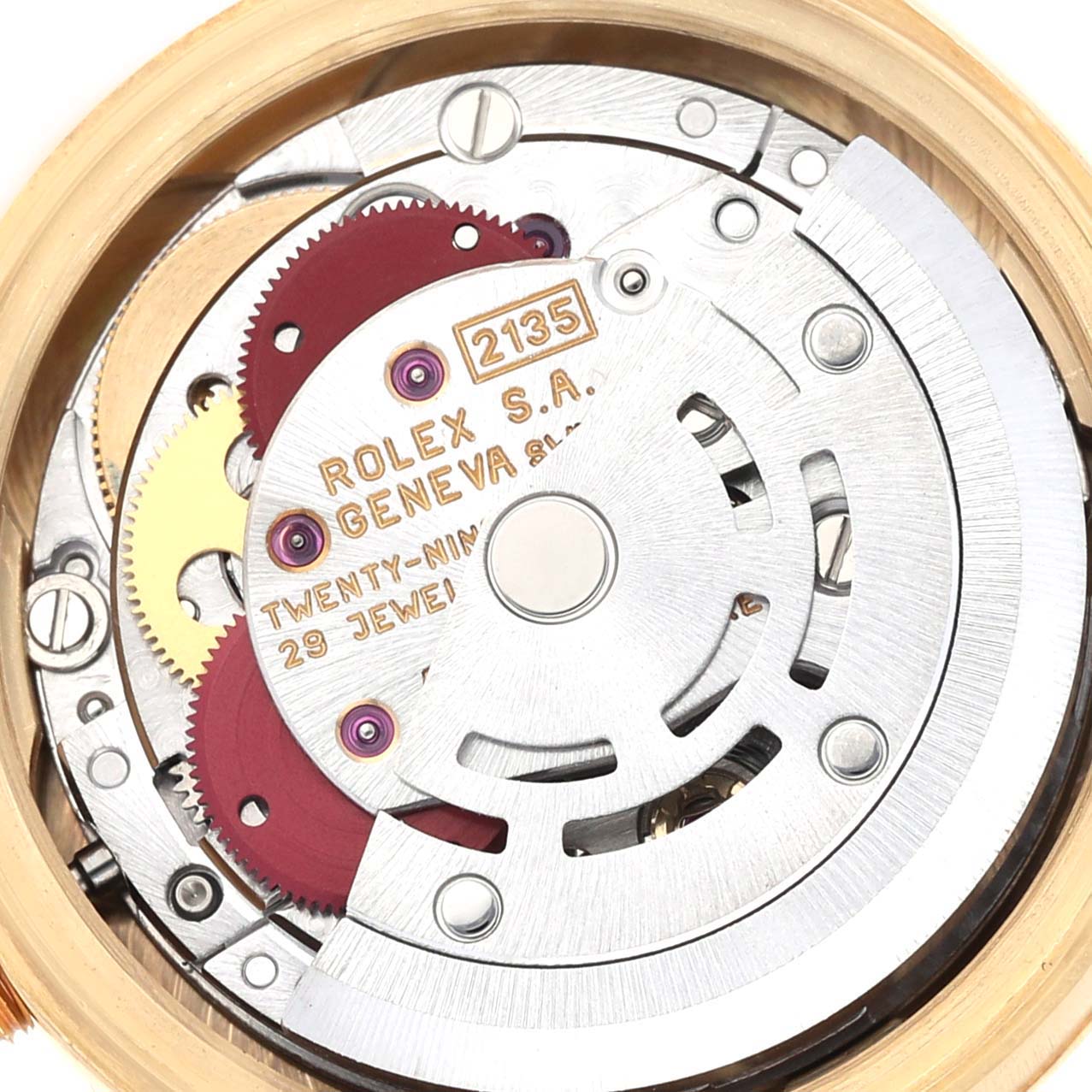 This close-up shot of a Rolex President 69178G Women
s Yellow Gold Champagne Dial 69178G Women
s Yellow Gold Champagne Dial model watch shows the intricate internal mechanics and the engraved details of the movement.