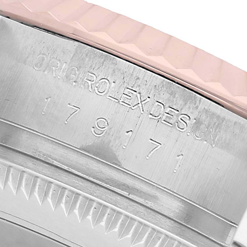 This image shows a close-up of the side engraving on a Rolex Datejust 179171 Women's Steel and Gold (two tone) Pink Dial, focusing on the "ORIG ROLEX DESIGN" text and part of the bezel.