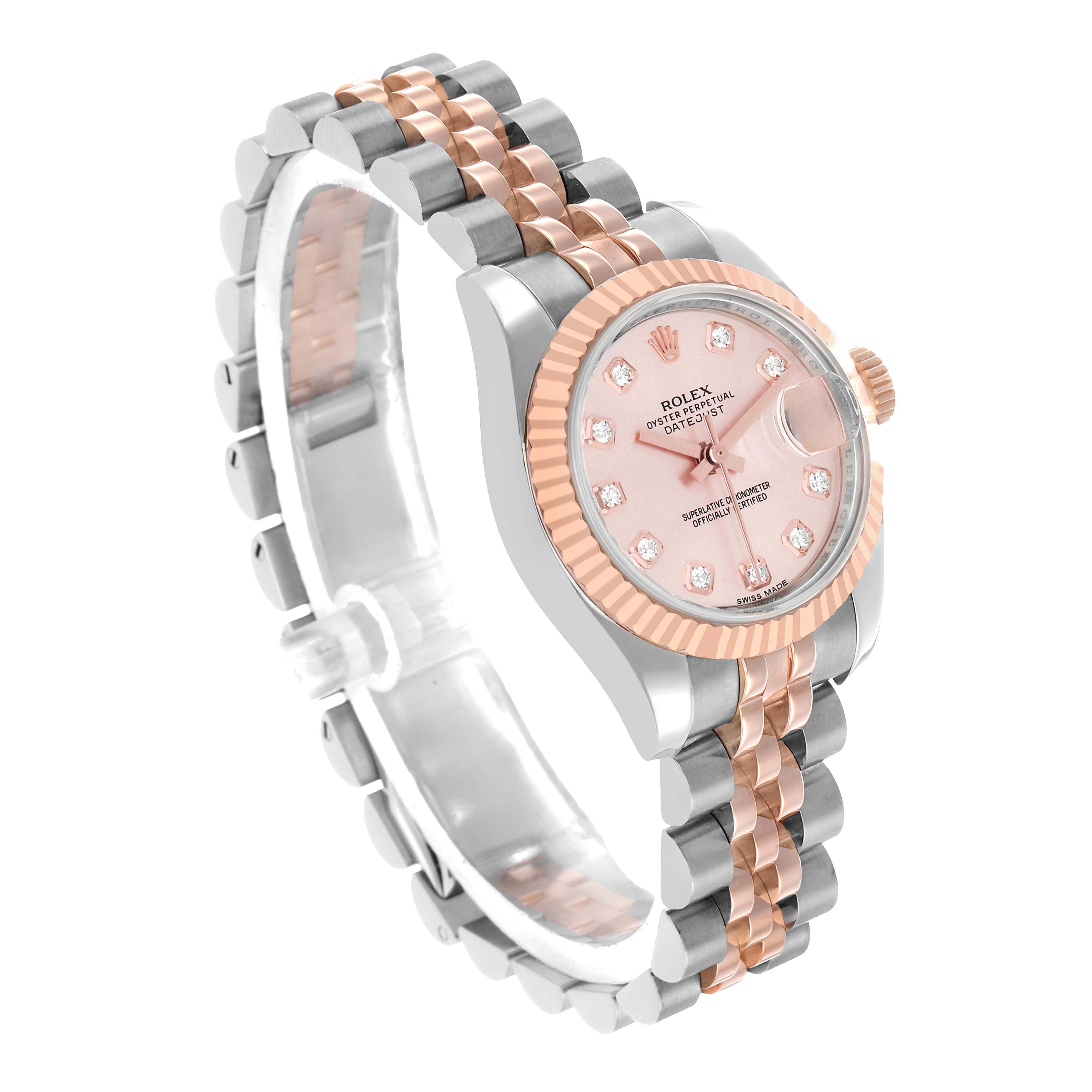 The Rolex Datejust 179171 Women's Steel and Gold (two tone) Pink Dial watch is shown at a three-quarter angle, highlighting the pink dial, fluted bezel, and two-tone bracelet.