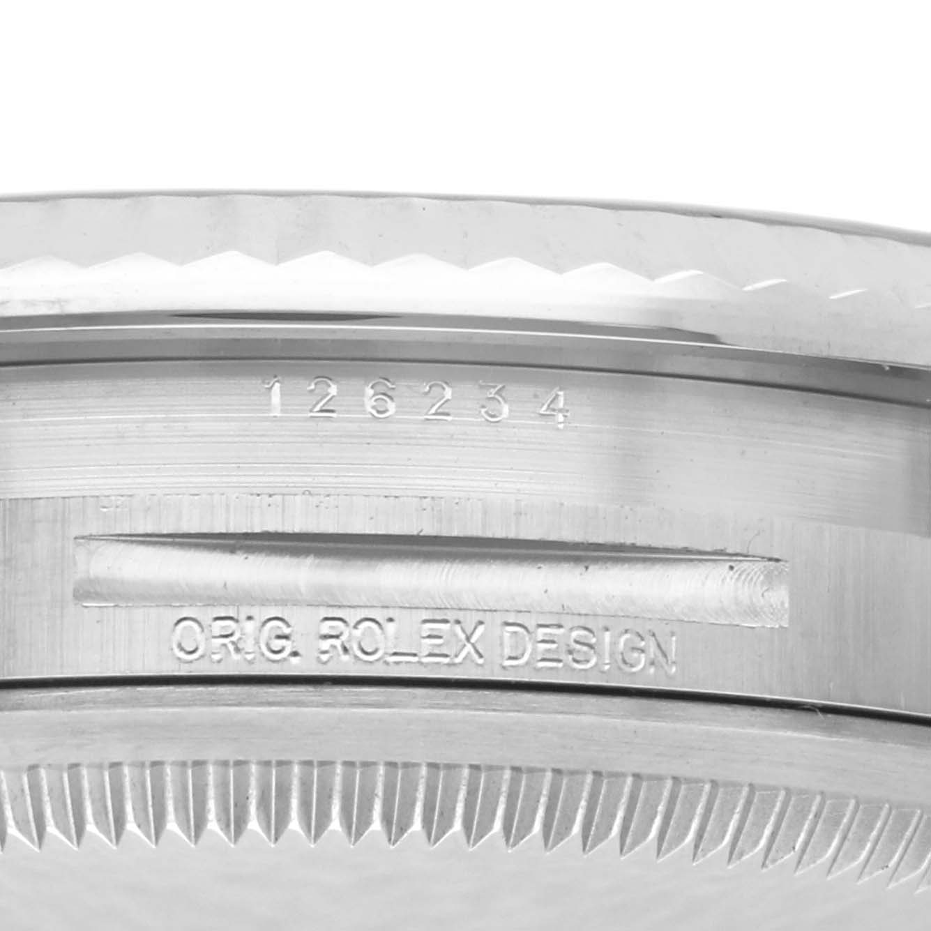 The image shows the side view of a Rolex Datejust 126234 Men's Stainless Steel Blue Dial 126234 Men's Stainless Steel Blue Dial with focus on the case edge and inscriptions.