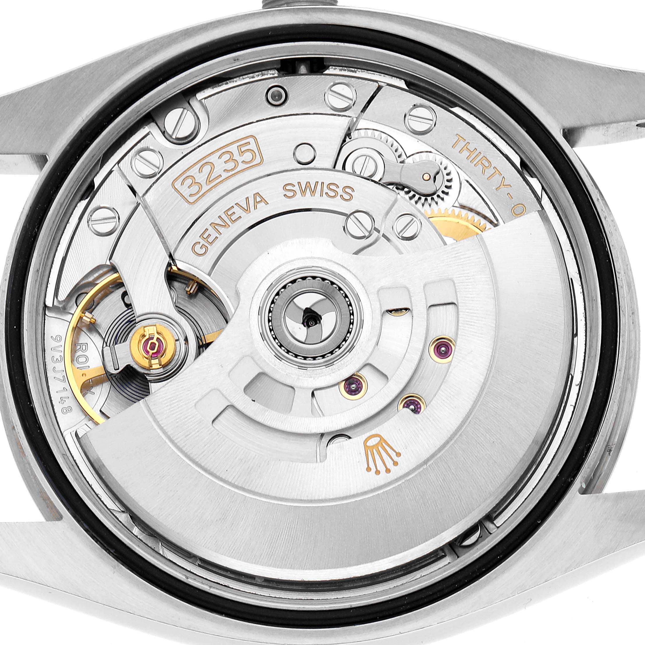 The image shows the movement of a Rolex Datejust 126234 Men's Stainless Steel White Dial watch, highlighting the rotor and internal mechanical components from the back.