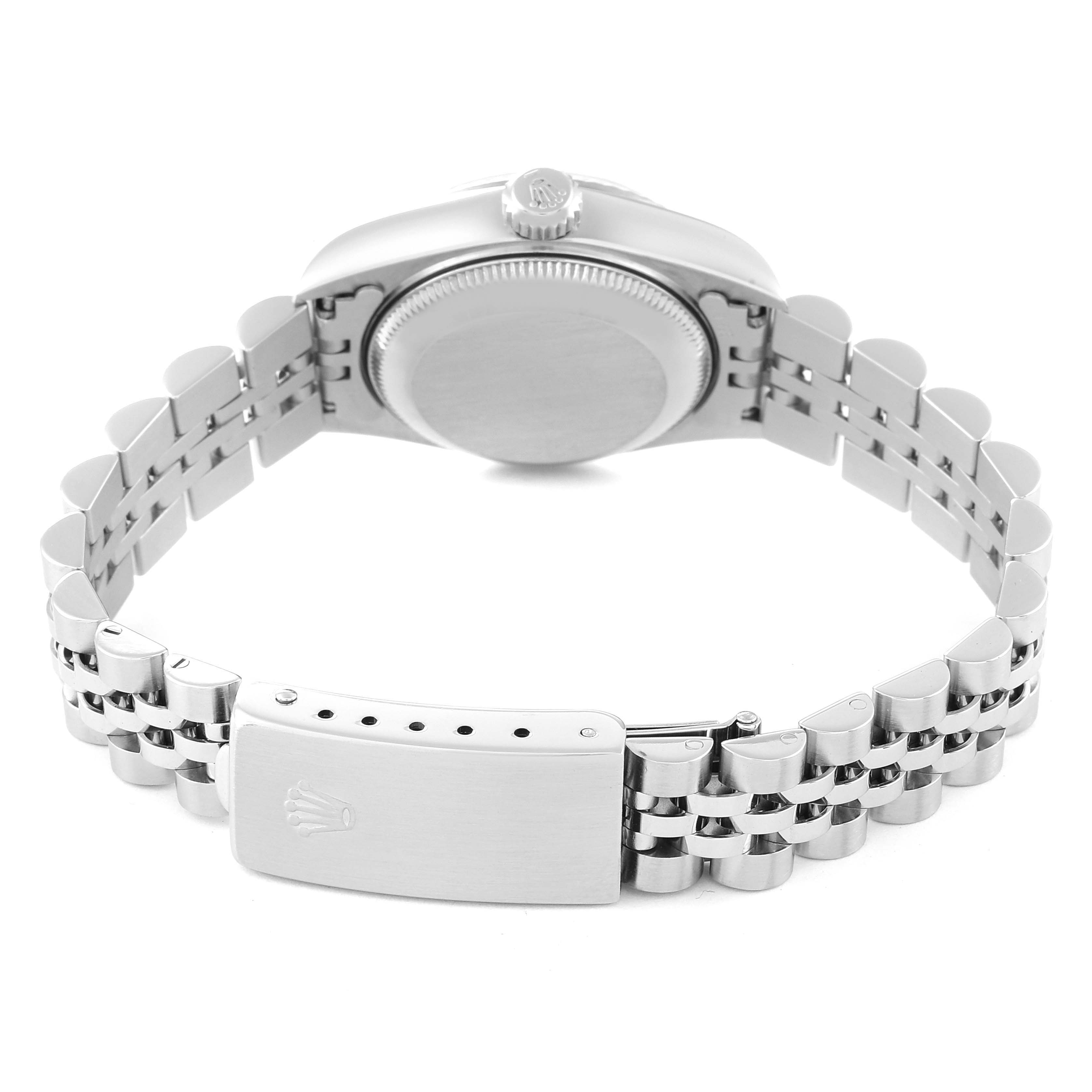 An upside-down view of the Rolex Datejust 69174 Women's Stainless Steel Silver Dial 69174 Women's Stainless Steel Silver Dial watch, highlighting the case back and the bracelet with its clasp.