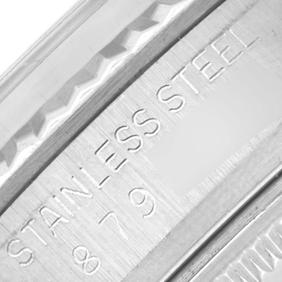 The image shows a close-up of the Rolex Vintage Collection 16014 Men's Stainless Steel Silver Dial 16014 Men's Stainless Steel Silver Dial watch's stainless steel engraving on the side.