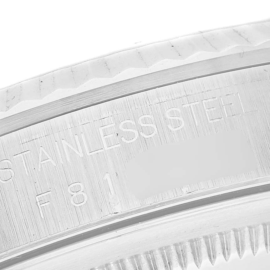 This image shows a close-up angle of the stainless steel case back edge of a Rolex Datejust 16234 Men's Stainless Steel Silver Dial 16234 Men's Stainless Steel Silver Dial watch.