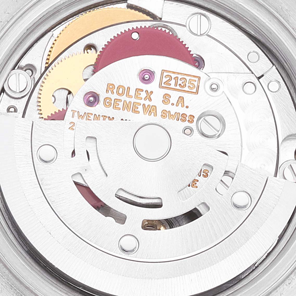 This image shows the inner mechanical movement of a Rolex Datejust 69173 Women's Steel and Gold (two tone) Beige Dial 69173 Women's Steel and Gold (two tone) Beige Dial watch from a close-up angle, displaying gears and engravings.