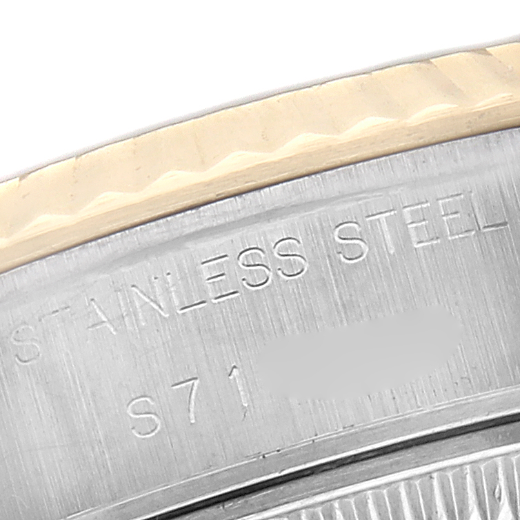 The image shows a close-up of the Rolex Datejust 69173 Women's Steel and Gold (two tone) Black Dial model, focusing on the stainless steel and part of the fluted bezel.