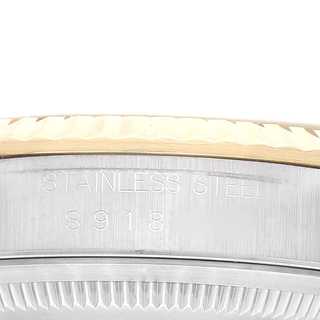 This image shows a close-up of the stainless steel outer rim with etchings on a Rolex Datejust 16233 Men's Steel and Gold (two tone) Champagne Dial 16233 Men's Steel and Gold (two tone) Champagne Dial watch.