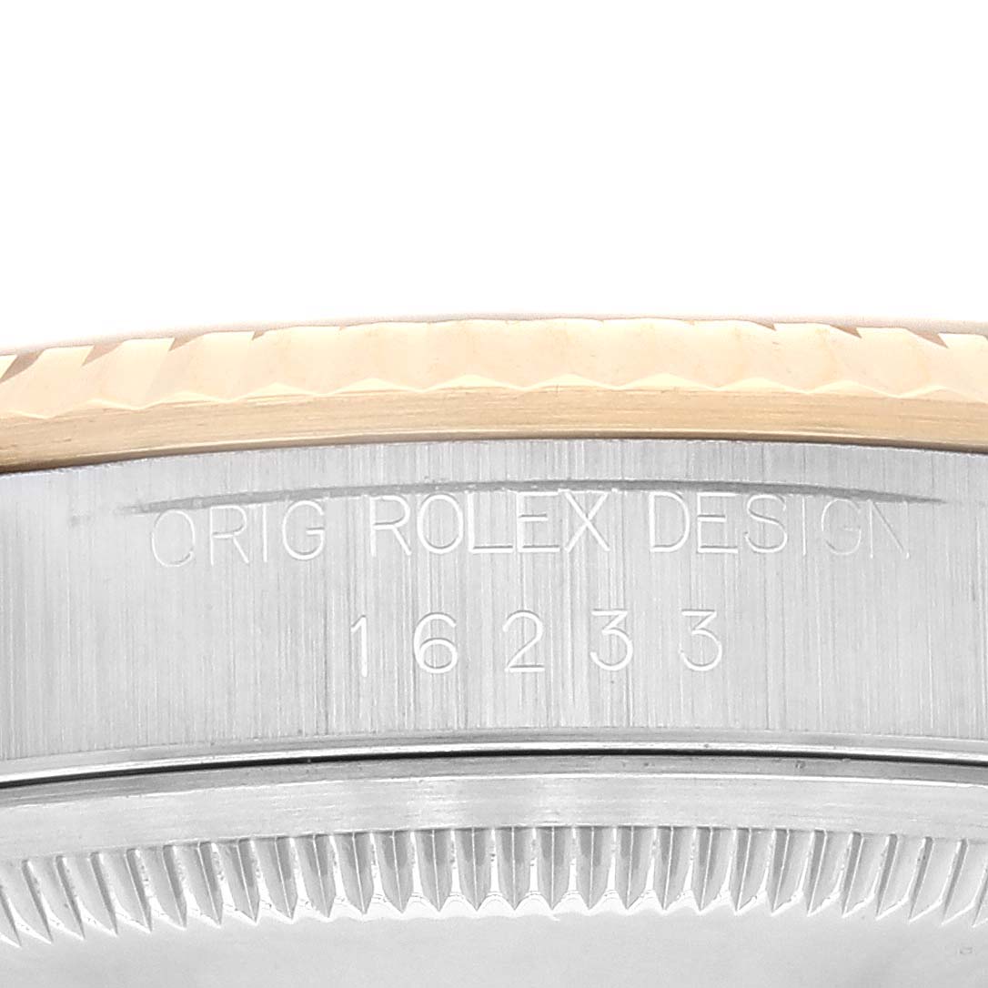 This image shows a close-up of the case side of a Rolex Datejust 16233 Men's Steel and Gold (two tone) Champagne Dial 16233 Men's Steel and Gold (two tone) Champagne Dial, displaying the "ORIG ROLEX DESIGN" engraving and model number 16233.