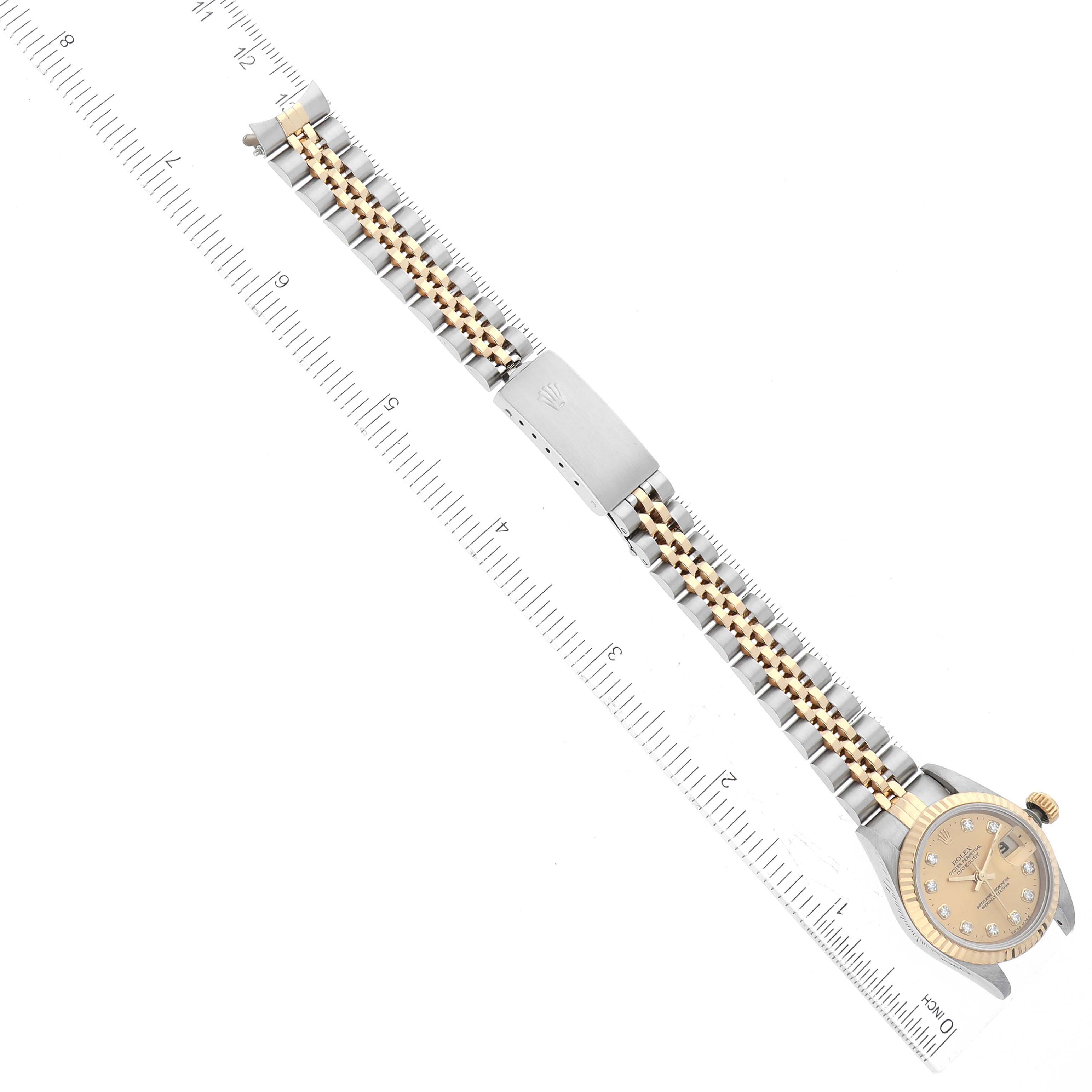 The image shows a Rolex Datejust 69173 Women's Steel and Gold (two tone) Champagne Dial 69173 Women's Steel and Gold (two tone) Champagne Dial watch bracelet and clasp with a ruler for measurement.