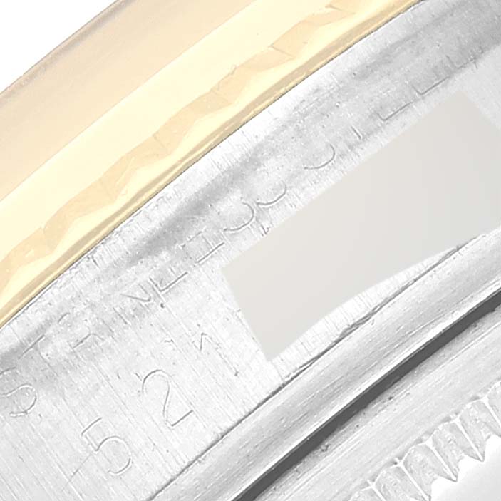 This image shows a close-up view of the case side and engraved serial number of a Rolex Vintage Collection 1601 Men's Steel and Gold (two tone) Silver Dial 1601 Men's Steel and Gold (two tone) Silver Dial watch.