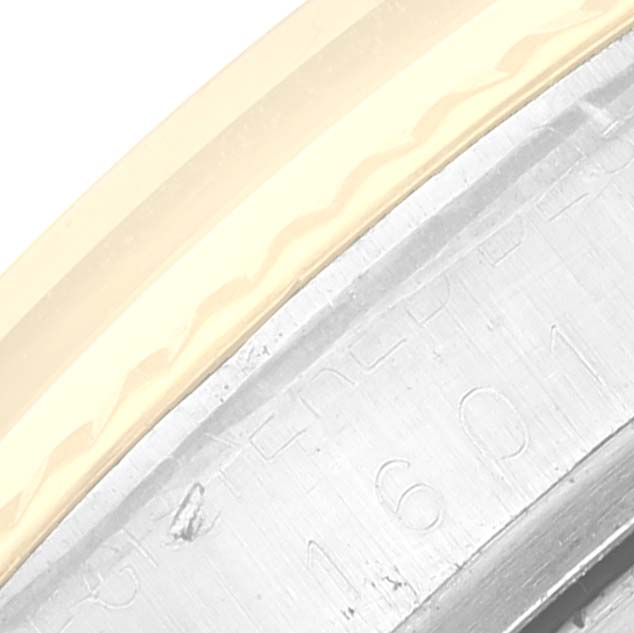 The image shows a close-up of the bezel and case edge, including engraved text, on a Rolex Vintage Collection 1601 Men's Steel and Gold (two tone) Silver Dial 1601 Men's Steel and Gold (two tone) Silver Dial watch.
