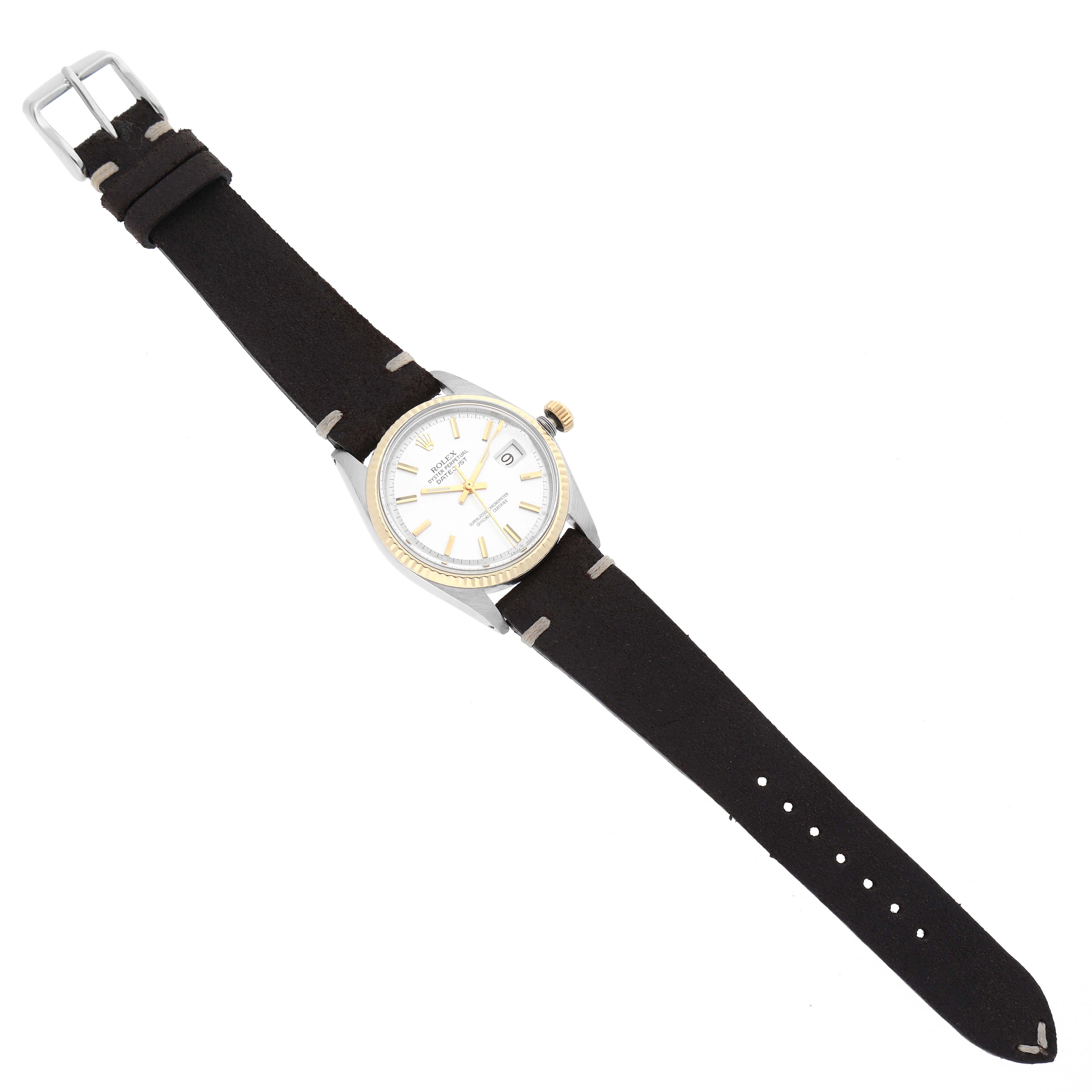 The image displays a full top view of a Vintage Collection Rolex watch, showing the face, bezel, crown, and leather strap.