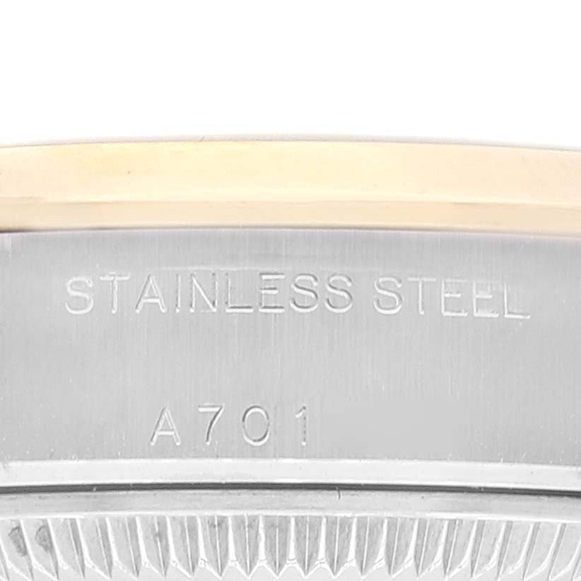 The image shows a close-up of the stainless steel casing and bezel of a Rolex Datejust 79163 Women's Steel and Gold (two tone) Grey Dial 79163 Women's Steel and Gold (two tone) Grey Dial watch, displaying "STAINLESS STEEL" and a serial number.