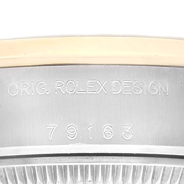 This image shows a close-up of the Rolex Datejust 79163 Women's Steel and Gold (two tone) Grey Dial 79163 Women's Steel and Gold (two tone) Grey Dial watch case, featuring the "ORIG. ROLEX DESIGN" engraving and model number.