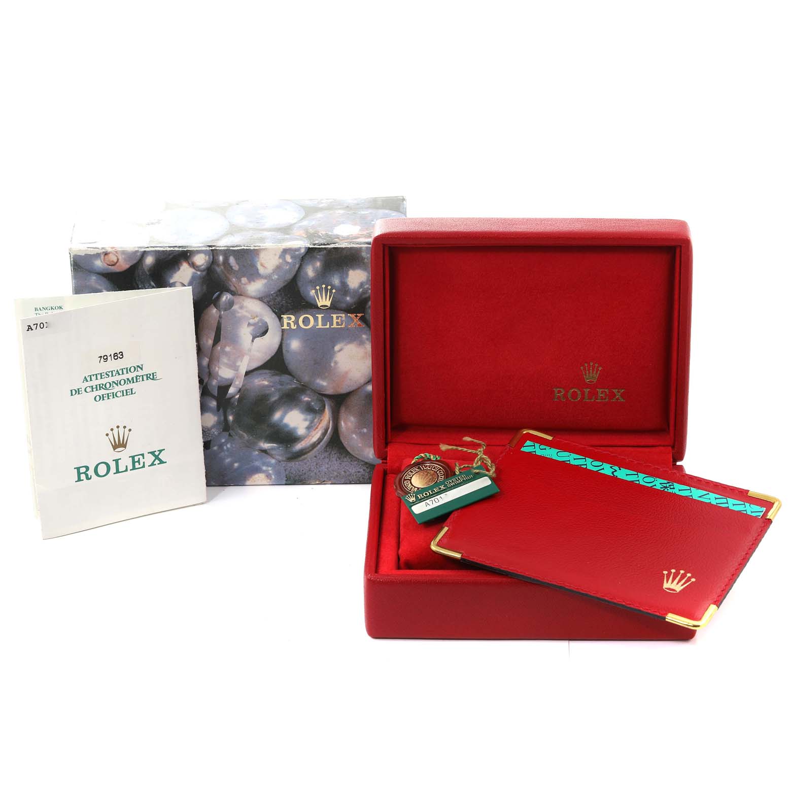 This image shows the box and accessories for a Rolex Datejust 79163 Women's Steel and Gold (two tone) Grey Dial 79163 Women's Steel and Gold (two tone) Grey Dial watch, including manuals, tags, and a red leather document holder.