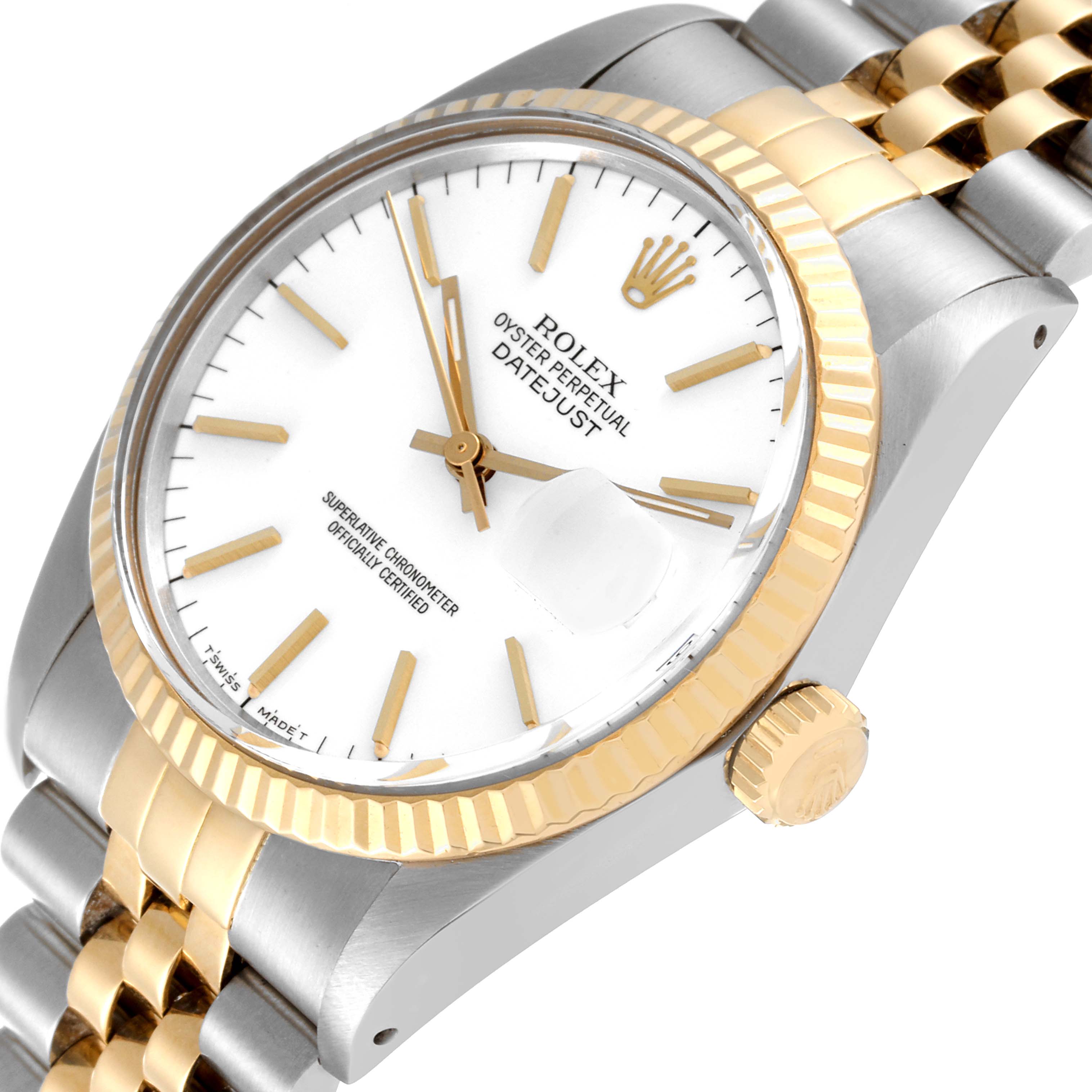 This is a close-up angled view of a Rolex Datejust 16013 Men's Steel and Gold (two tone) White Dial 16013 Men's Steel and Gold (two tone) White Dial watch, displaying the dial, fluted bezel, crown, and part of the jubilee bracelet.